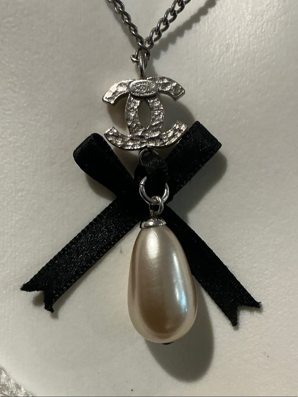CHANEL Silver-Tone Necklace with Black Ribbon and Pearl Drop